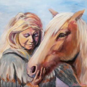 Portrait of a beautiful woman with a horse